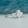 Elegant three stone oval diamond ring with brilliant sparkle