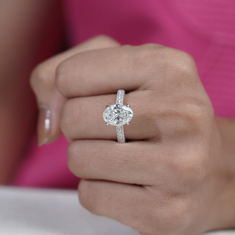 Pave band engagement ring with oval diamond