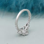 White gold oval cut diamond ring with delicate pave