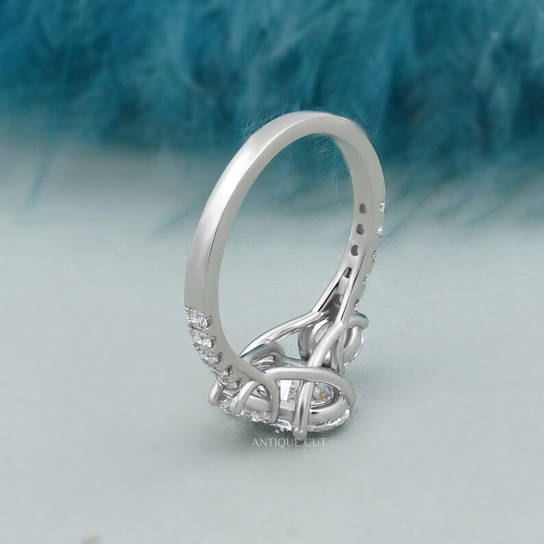 White gold oval cut diamond ring with delicate pave