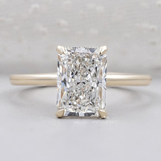 Radiant cut diamond ring solitaire yellow gold