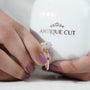 Classic solitaire ring with hidden halo