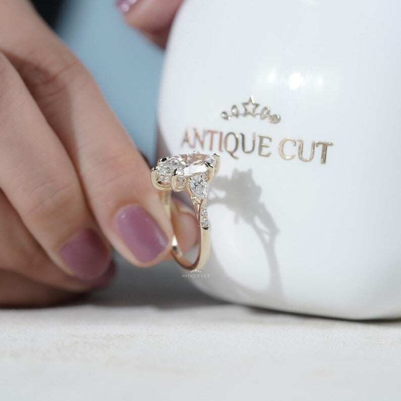 Pear side stones marquise engagement ring close up