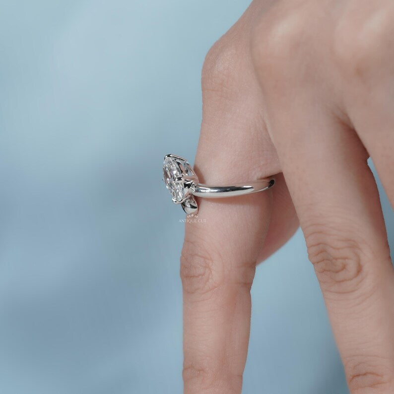 Finger flattering oval solitaire engagement ring