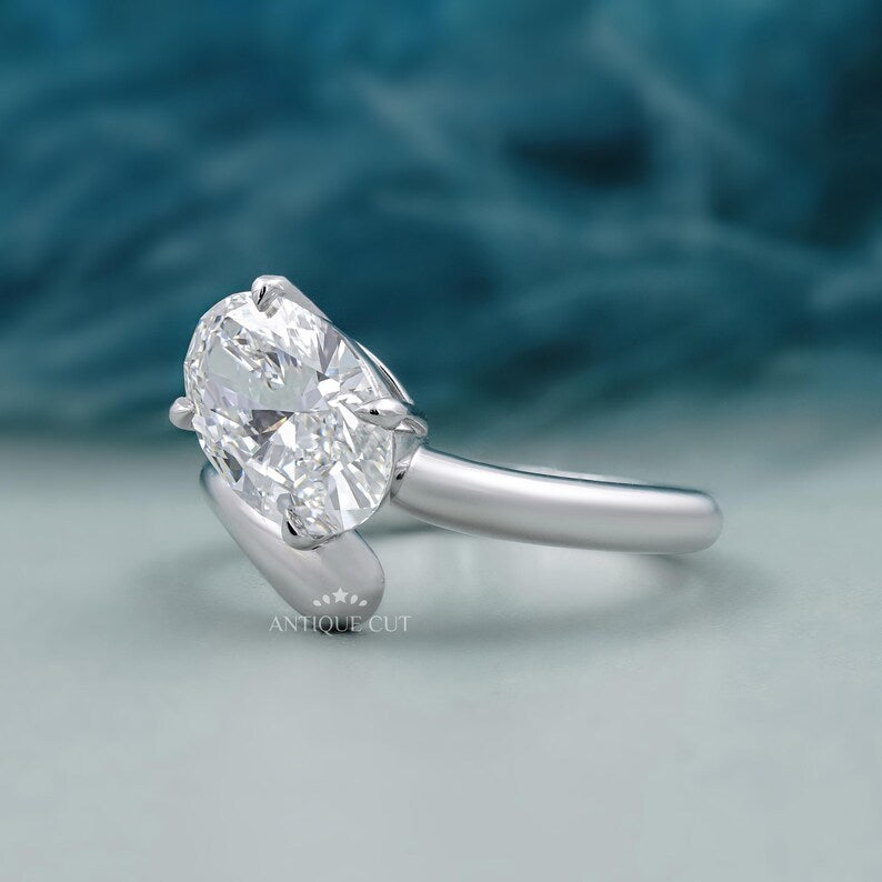 Lab grown oval engagement ring bypass band