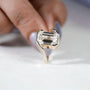 Sleek emerald cut diamond solitaire ring