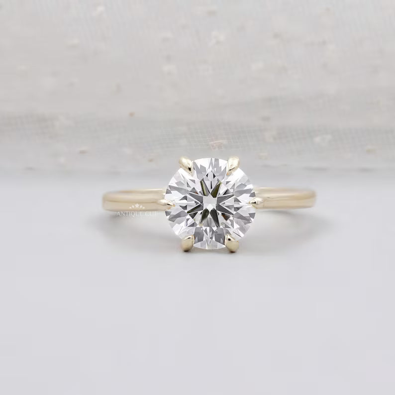 Round cut engagement ring with 6 prong solitaire