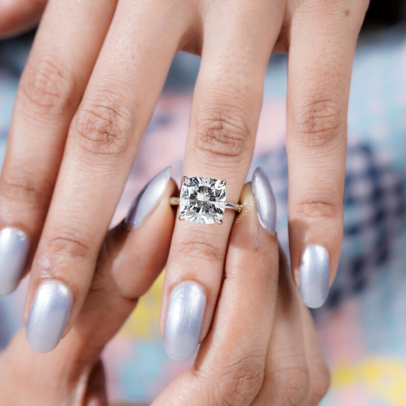 Statement cushion diamond ring with subtle halo effect