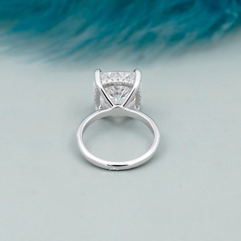 Cushion cut diamond ring with concealed halo design