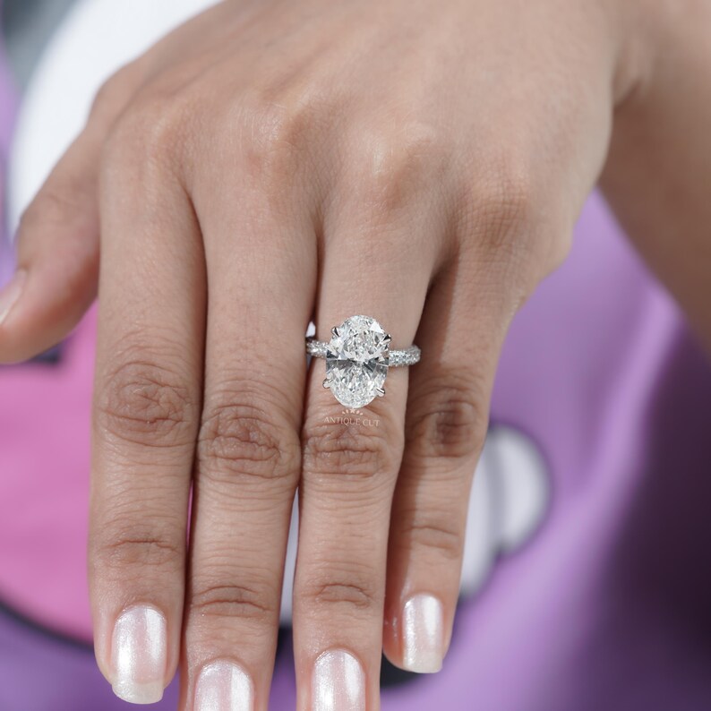 Luxury oval diamond ring with pave band