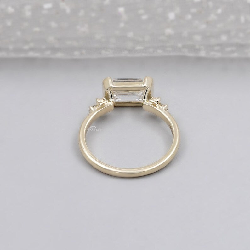 Minimalist emerald cut lab grown diamond ring in east west setting