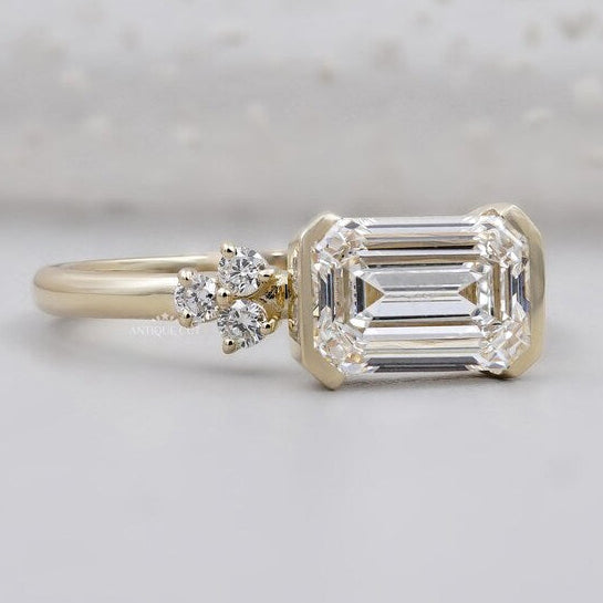 Horizontal emerald cut diamond engagement ring modern yellow gold design