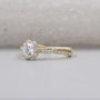 Twisted band ring with round cut diamond