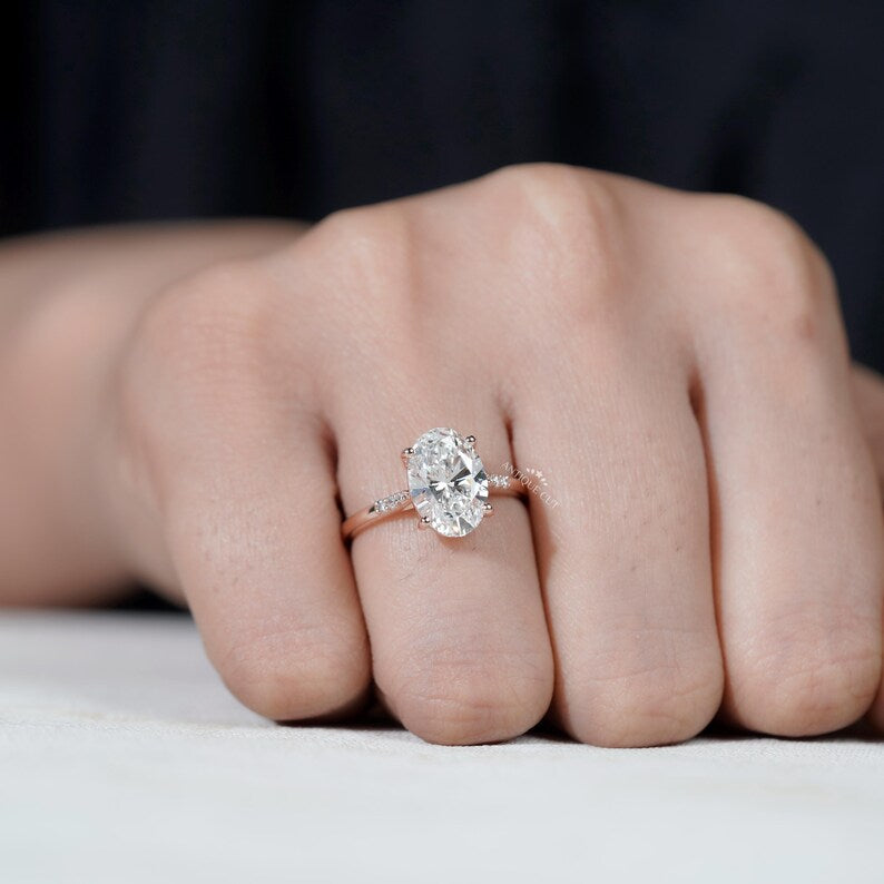 Statement oval cut diamond ring with pave rose gold halo