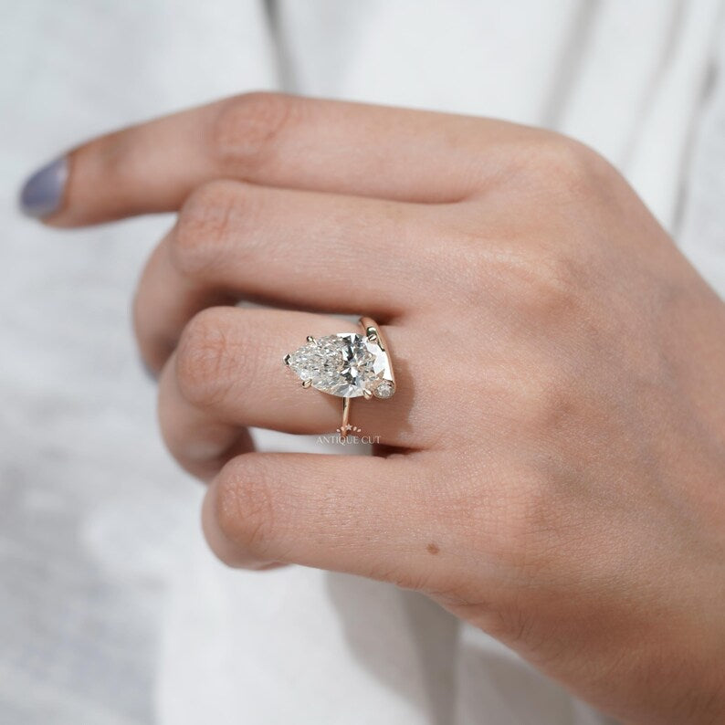 Ethical lab grown pear diamond ring yellow gold side stones