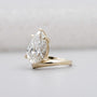 Lab grown pear diamond ring with pear side stones yellow gold