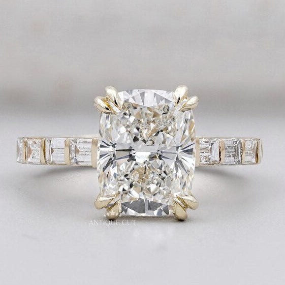 Cushion cut engagement ring with pave band in yellow gold