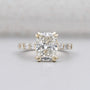 Cushion cut engagement ring with pave band in yellow gold