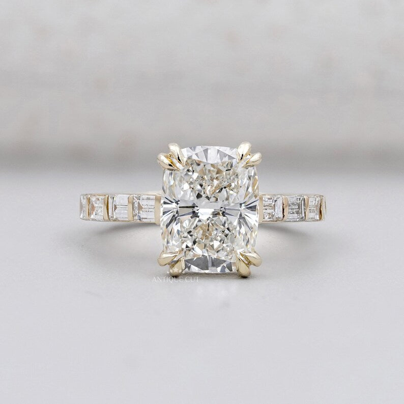 Cushion cut engagement ring with pave band in yellow gold