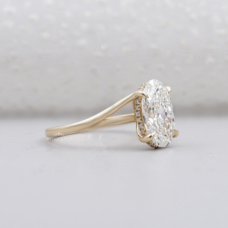 Yellow gold oval engagement ring hidden halo