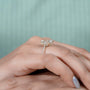 Refined oval engagement ring with hidden halo yellow gold