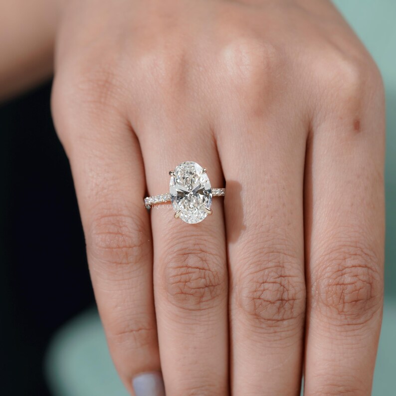 Yellow gold engagement ring oval lab diamond hidden halo