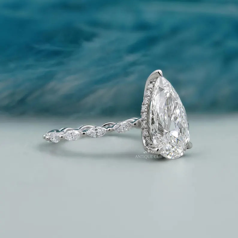White gold pear cut diamond ring hidden halo pave design