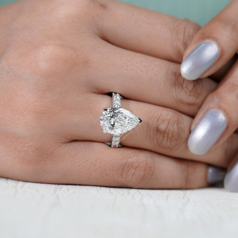 Timeless pear cut engagement ring white gold pave diamonds