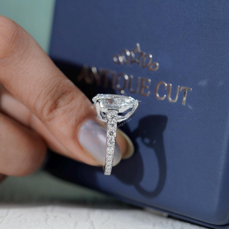 Minimalist pear shape diamond ring white gold pave detail