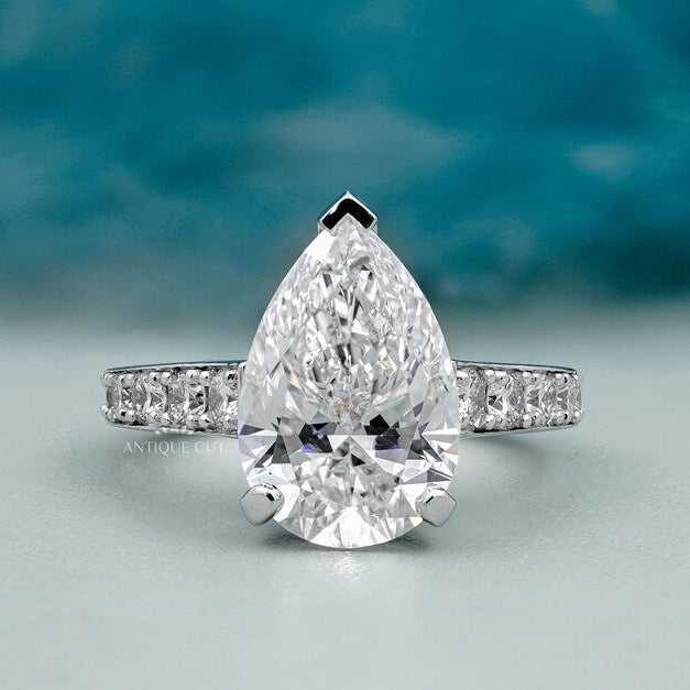 Pear shape diamond engagement ring white gold pave band