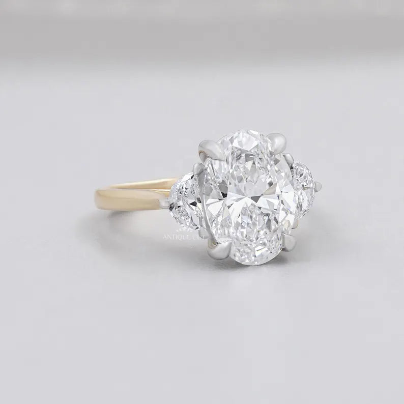 Lab grown oval cut diamond ring yellow gold side stones