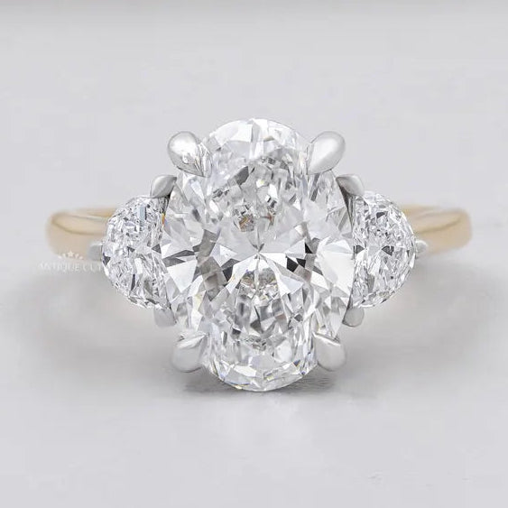 Oval cut three stone engagement ring yellow gold lab diamond