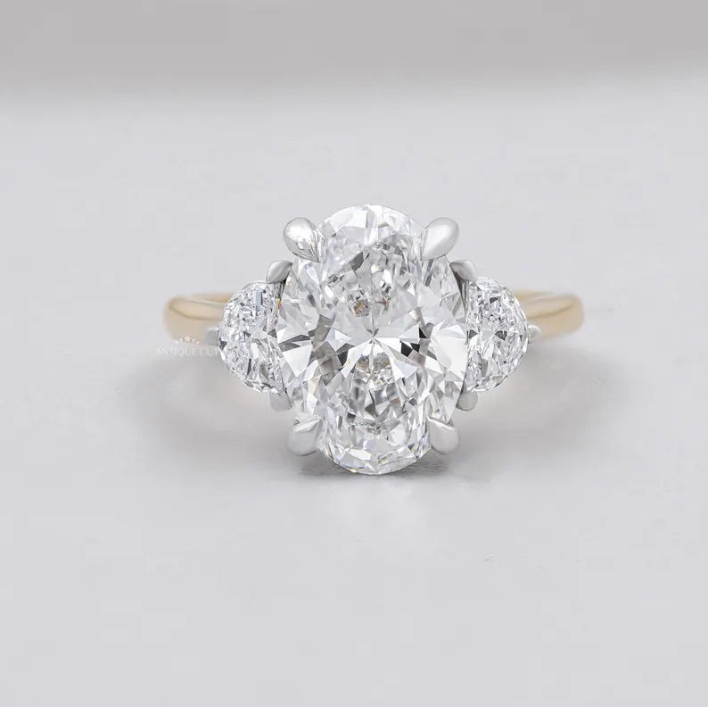 Oval cut three stone engagement ring yellow gold lab diamond