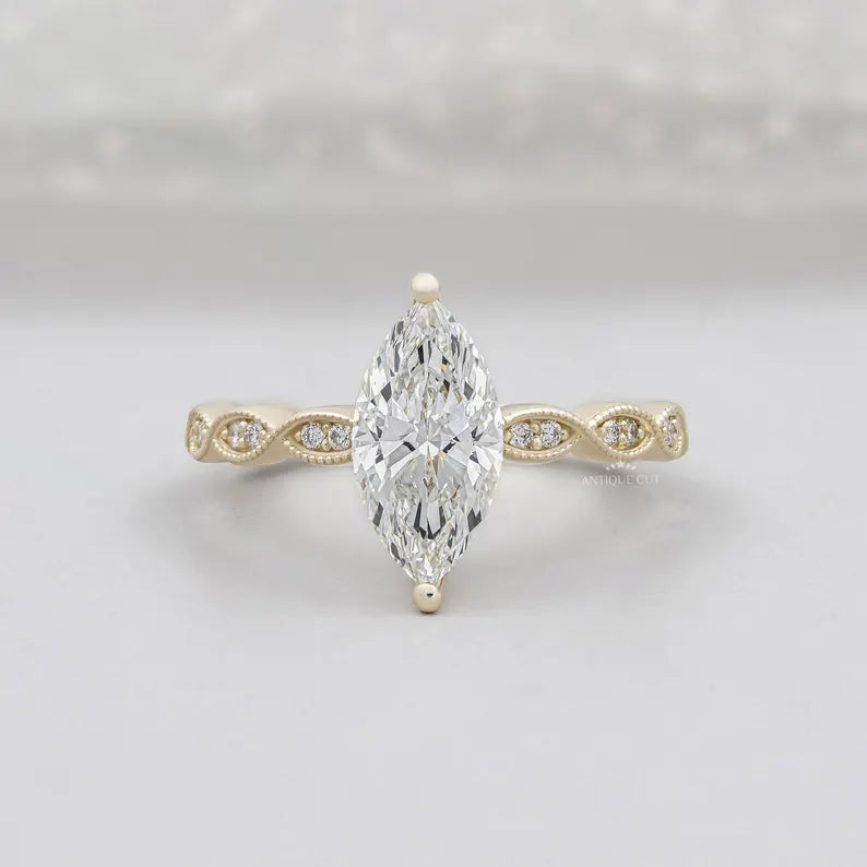 Marquise cut engagement ring in yellow gold