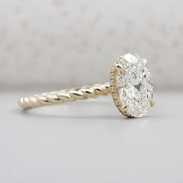 Yellow gold oval diamond ring with hidden halo