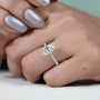 Classic oval diamond engagement ring with shimmering band