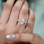 Sophisticated oval engagement ring with diamond pave band
