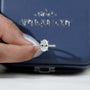 Oval diamond ring with sparkling round pave diamonds on band