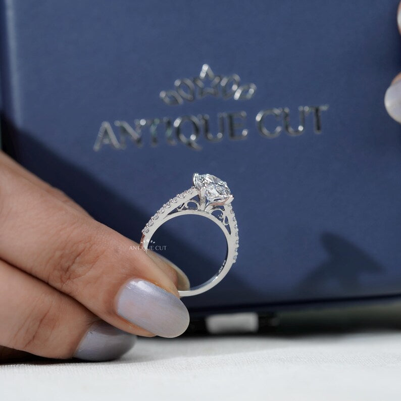 Timeless oval engagement ring with pave diamond detailing
