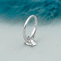 White gold oval cut diamond ring with delicate pave setting