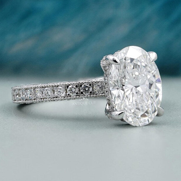 White gold oval diamond ring with hidden halo