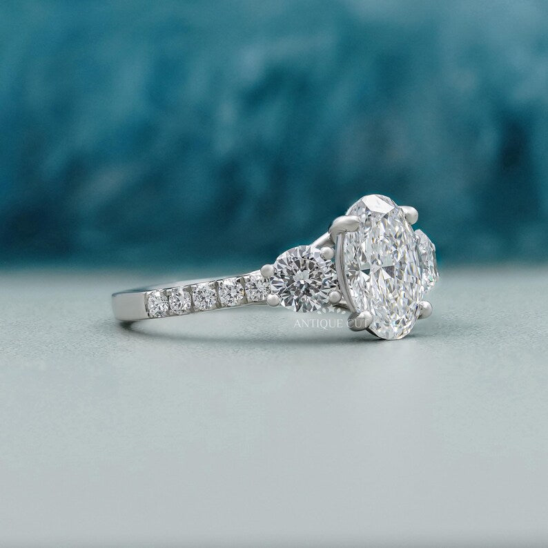 Elegant oval diamond engagement ring with pave setting