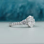 Elegant oval diamond engagement ring with pave setting