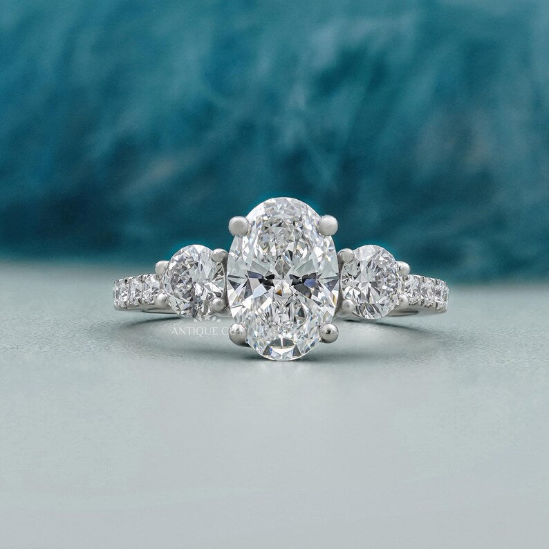 Oval cut diamond ring with pave band in white gold