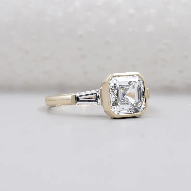 Three stone asscher diamond engagement ring