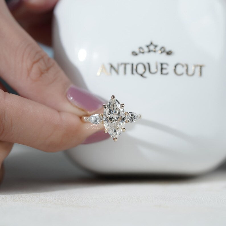 Antiquecut marquise three stone diamond ring