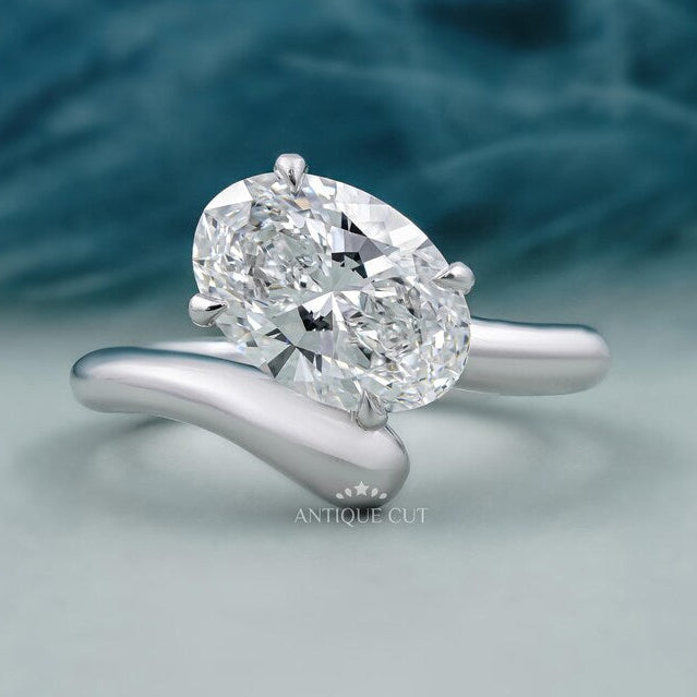 Oval cut engagement ring bypass gold design