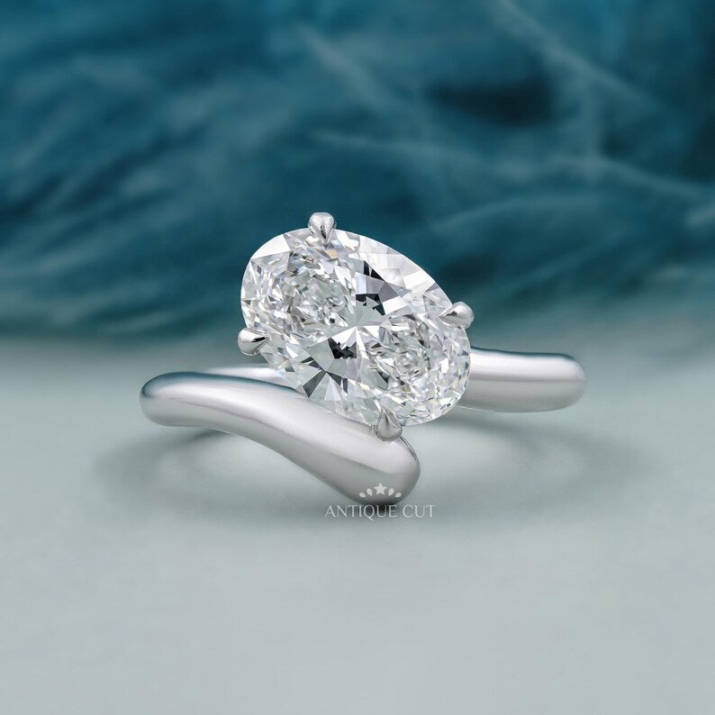 Oval cut engagement ring bypass gold design