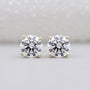 Round cut diamond stud earrings yellow gold