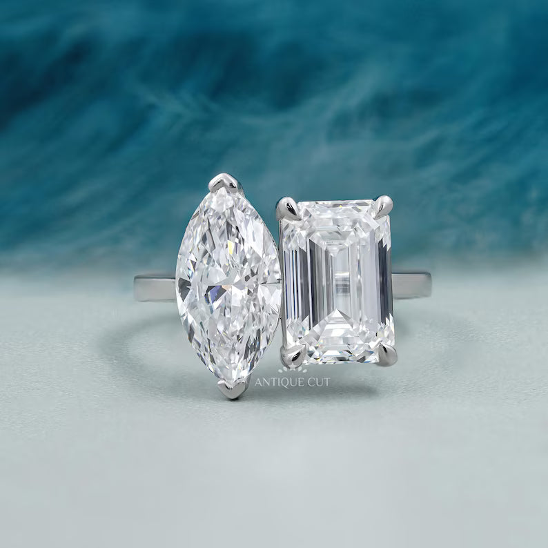 Toi et moi engagement ring emerald and marquise diamond